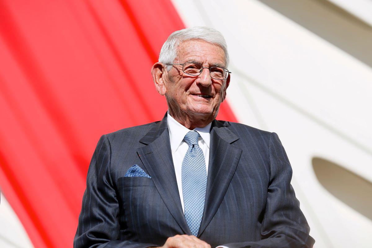 The late Eli Broad smiling in a blue suit